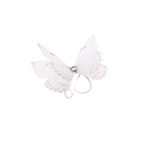 Women silk butterfly ring in sterling silver, with adjustable base. The ring has a very strong and resistant silver double base, which can easily be adjusted to your desired size. The enchanting silk butterfly has 2 layers to offer it a 3D design and make it look more as a real butterfly. Due to the properties of silk, the wings move gently with the wearer, making it look like the flutter of a real butterfly. It is a very special and strong ring, even if it looks fragile. Being made of 100% silk, the butterfly is as strong as you silk garment is.